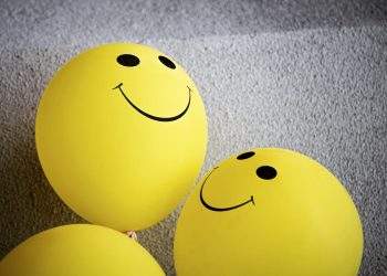 Yellow Smiley Emoji on Gray Surface